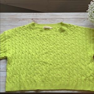 Women’s neon green cropped cable knit sweater.